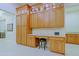 Kitchen nook area with built-in desk, granite countertops, and ample wood cabinetry at 6044 E Hodges St, Cave Creek, AZ 85331