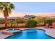 Gorgeous pool and spa with mountain views, lounge chairs, and lush desert landscaping at 6044 E Hodges St, Cave Creek, AZ 85331