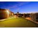 Backyard putting green with desert landscaping, artificial turf, and desert surroundings at 6044 E Hodges St, Cave Creek, AZ 85331