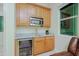 Charming wet bar features granite countertops, stainless steel appliances, and ample storage at 6044 E Hodges St, Cave Creek, AZ 85331