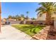 Large backyard with a well-maintained lawn, a concrete patio and a block wall at 617 N Cobblestone St, Gilbert, AZ 85234