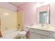 Charming bathroom with vintage details, vanity, and shower-tub combo at 617 N Cobblestone St, Gilbert, AZ 85234