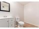 Bathroom vanity with a neutral sink, hardware, and lighting at 617 N Cobblestone St, Gilbert, AZ 85234