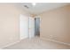 This bedroom is carpeted and features closet with paneled sliding doors and a ceiling fan at 617 N Cobblestone St, Gilbert, AZ 85234