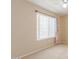 Cozy bedroom with neutral carpet, walls, a ceiling fan and a window with a view at 617 N Cobblestone St, Gilbert, AZ 85234