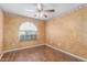 Bedroom has an abundance of natural light and wood-look flooring at 617 N Cobblestone St, Gilbert, AZ 85234