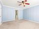 Relaxing bedroom features soft blue walls and a ceiling fan at 617 N Cobblestone St, Gilbert, AZ 85234