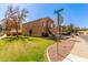 Corner lot home with a manicured front yard and a two car garage featuring desert landscaping at 617 N Cobblestone St, Gilbert, AZ 85234