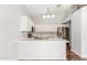 Bright kitchen featuring a spacious island with white countertops and modern stainless steel appliances at 617 N Cobblestone St, Gilbert, AZ 85234