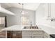 Kitchen sink on island overlooking stainless dishwasher and stainless steel faucet at 617 N Cobblestone St, Gilbert, AZ 85234