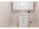 Bright laundry room with white cabinets, offering ample storage and a clean, functional space at 617 N Cobblestone St, Gilbert, AZ 85234