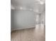 Bright and airy living room featuring light wood flooring, gray walls, and a modern ceiling fan at 625 N Hamilton St # 36, Chandler, AZ 85225
