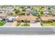 Aerial view of single-Gathering home with lush front yard, driveway, and neighboring houses at 6409 W Riviera Dr, Glendale, AZ 85304
