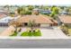 Spacious single-story home features a large driveway, well-manicured lawn, and a neighborhood setting at 6409 W Riviera Dr, Glendale, AZ 85304