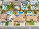 Residential aerial view of a neighborhood with homes, pools, solar panels, and RV parking at 6409 W Riviera Dr, Glendale, AZ 85304