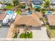 Aerial view of a single-Gathering home featuring a well-maintained front yard, driveway, and an RV parked on the side at 6409 W Riviera Dr, Glendale, AZ 85304