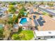 Aerial view of home with a pool, solar panels, shed, and well-maintained backyard at 6409 W Riviera Dr, Glendale, AZ 85304