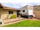 Residential backyard featuring an RV parked beside a home, showcasing the available space and landscaping at 6409 W Riviera Dr, Glendale, AZ 85304
