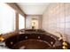 Large soaking tub in bathroom for ultimate relaxation and a spa-like experience at 6409 W Riviera Dr, Glendale, AZ 85304