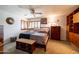 Serene bedroom with shutters and generous storage for a peaceful retreat, offering comfort and functionality at 6409 W Riviera Dr, Glendale, AZ 85304