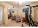 Multi-purpose room featuring a safe, heavy bag, chair, and a ceiling fan with a mirrored closet at 6409 W Riviera Dr, Glendale, AZ 85304