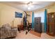 Multi-purpose room featuring a safe, heavy bag, chair, and a ceiling fan at 6409 W Riviera Dr, Glendale, AZ 85304