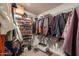 Walk-in closet with shelving and hanging space provides ample storage for clothing and accessories at 6409 W Riviera Dr, Glendale, AZ 85304