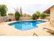 Private backyard pool with lounge chairs for relaxation and summer fun at 6409 W Riviera Dr, Glendale, AZ 85304