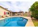 Backyard pool and covered patio for outdoor enjoyment and leisure at 6409 W Riviera Dr, Glendale, AZ 85304