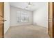 Bright bedroom with white walls, carpet flooring, and a ceiling fan at 7603 E Soaring Eagle Way, Scottsdale, AZ 85266