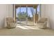 Bright bedroom with a seating area and desert views at 7603 E Soaring Eagle Way, Scottsdale, AZ 85266