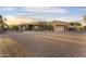 Charming home boasts desert landscaping and a spacious driveway at 7603 E Soaring Eagle Way, Scottsdale, AZ 85266