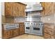 Gourmet kitchen features stainless steel appliances and custom cabinetry at 7603 E Soaring Eagle Way, Scottsdale, AZ 85266