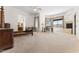 Spacious bedroom with neutral carpet, a fireplace, large windows and access to a main bathroom at 7603 E Soaring Eagle Way, Scottsdale, AZ 85266