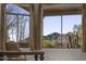 Picturesque mountain views from the home's large windows with custom tan curtains at 7603 E Soaring Eagle Way, Scottsdale, AZ 85266