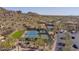 Aerial view of newly resurfaced tennis courts with desert views and lush landscaping at 7603 E Soaring Eagle Way, Scottsdale, AZ 85266