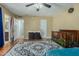 A bedroom features wood floors, a ceiling fan, and a crib at 7605 W Avalon Dr, Phoenix, AZ 85033