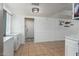 A bright dining area features a large open space and tile floors at 7605 W Avalon Dr, Phoenix, AZ 85033