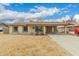 Charming single-story home with a covered carport and well-lit windows showcasing the exterior at 7605 W Avalon Dr, Phoenix, AZ 85033