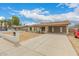 Attractive single-story house with a long driveway and mailbox near the street, showcasing curb appeal at 7605 W Avalon Dr, Phoenix, AZ 85033