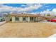 Inviting single-story home featuring a side view, complemented by a carport for convenient parking at 7605 W Avalon Dr, Phoenix, AZ 85033