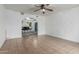 Bright living room featuring tile floors, a ceiling fan, and an open archway to dining area at 7605 W Avalon Dr, Phoenix, AZ 85033