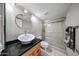 This bathroom features a walk-in shower with a glass enclosure and vanity with an undermount sink at 7860 E Camelback Rd # 309, Scottsdale, AZ 85251