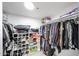 Organized walk-in closet with shelves and hanging racks for clothes and accessories at 7860 E Camelback Rd # 309, Scottsdale, AZ 85251
