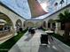 Inviting courtyard featuring seating areas and lush landscaping for outdoor relaxation at 7860 E Camelback Rd # 309, Scottsdale, AZ 85251