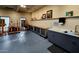Spacious craft room with countertops, cabinetry, and work easels, an ideal studio at 7860 E Camelback Rd # 309, Scottsdale, AZ 85251