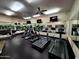 Spacious gym with treadmills, ellipticals and wall mounted TVs at 7860 E Camelback Rd # 309, Scottsdale, AZ 85251