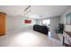 Open living room with a ceiling fan and glass sliding doors leading to a patio at 7860 E Camelback Rd # 309, Scottsdale, AZ 85251