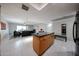 Open concept kitchen and living room space featuring tile flooring and modern finishes at 7860 E Camelback Rd # 309, Scottsdale, AZ 85251