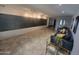 Modern lobby with stylish furniture, textured wall art, and tiled flooring at 7860 E Camelback Rd # 309, Scottsdale, AZ 85251